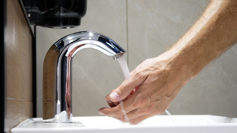 Touchless faucets washing hands