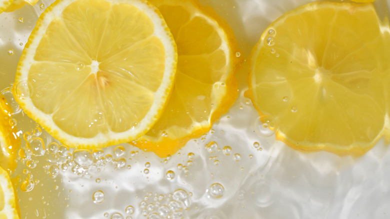 Citrus fruit slices boiling in water