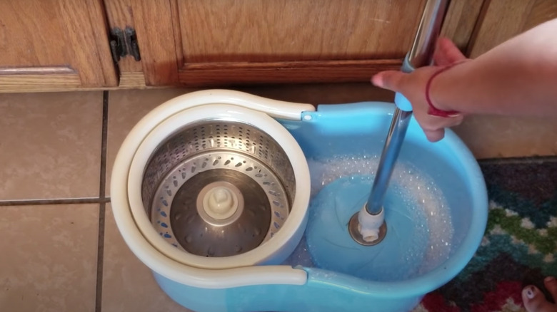 Cleaning mop in bucket