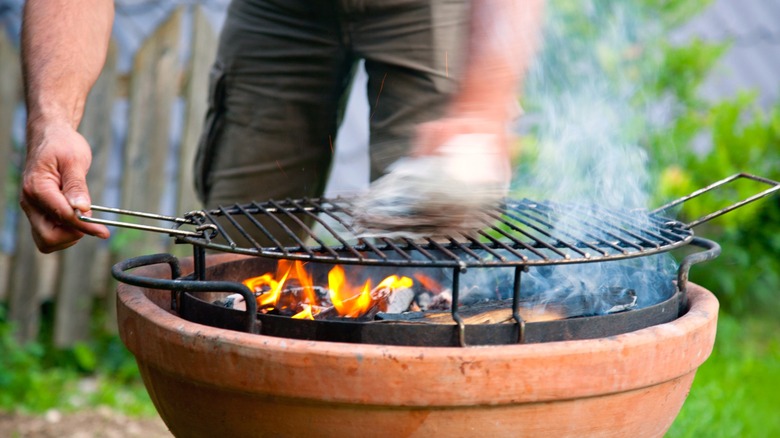 Scrubbing a BBQ grill