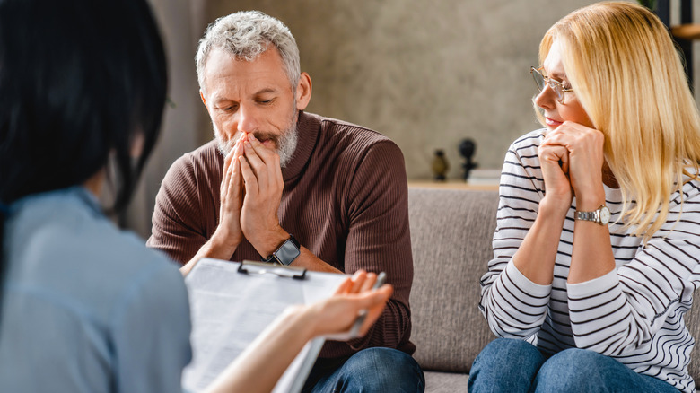 stressed couple with realtor