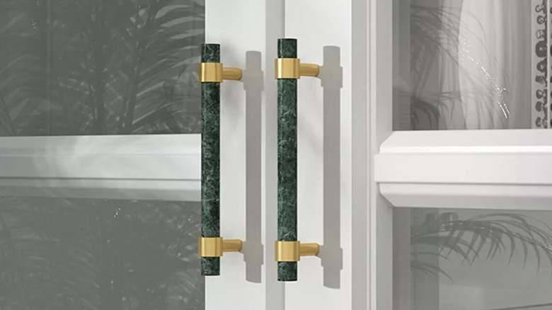 green marble and brass cabinet pulls