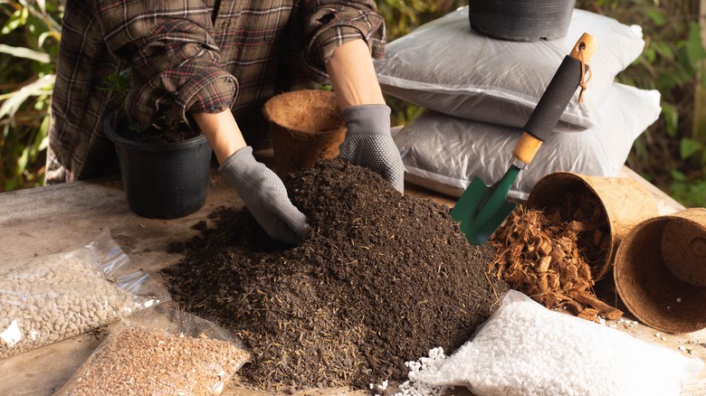 hands mixing soil