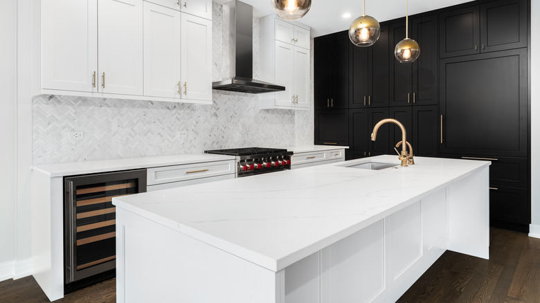 White kitchen with dark floors