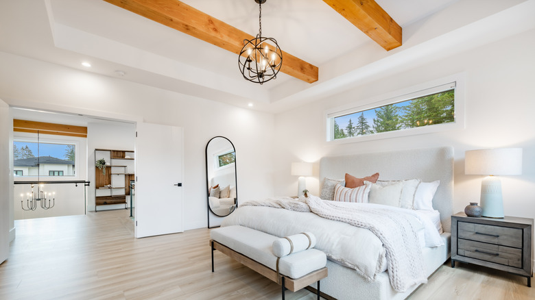 Bedroom with wood ceiling beams