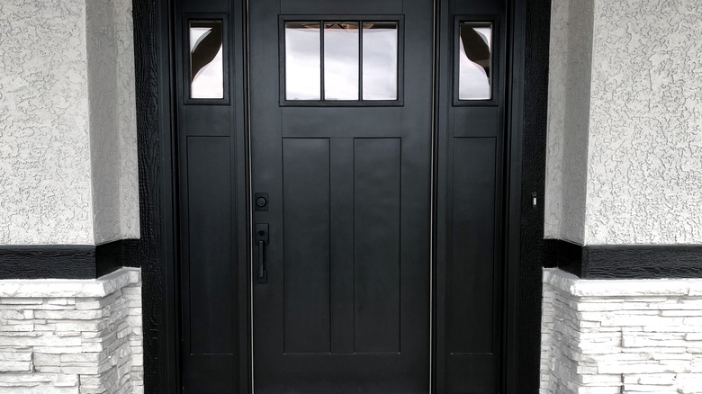 black front door with side panels