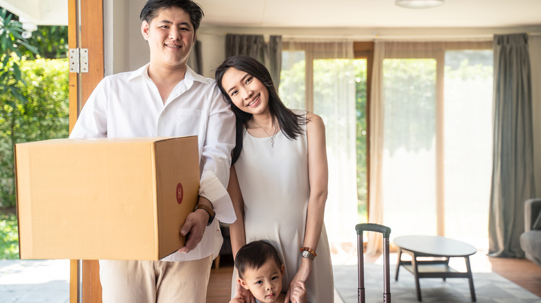 Family moving with box