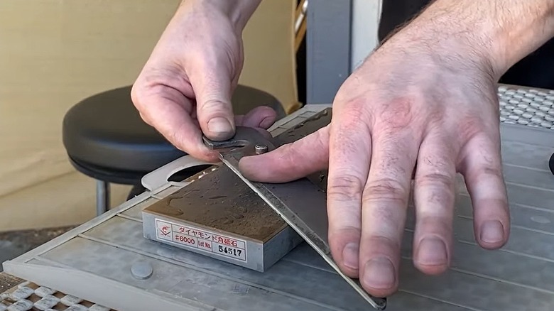 Man sharpening shears