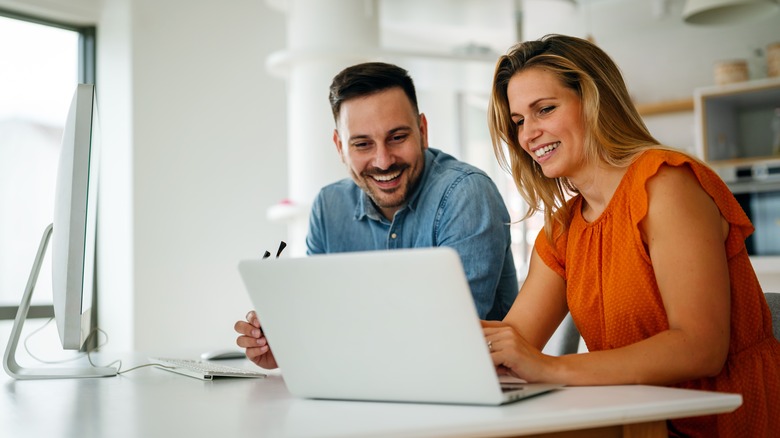 Couple using a laptop