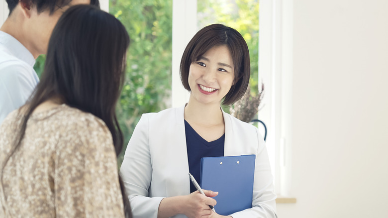 real estate agent with couple