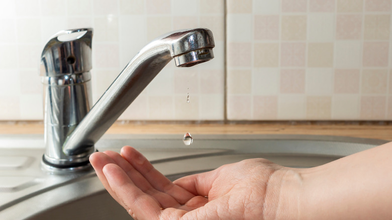 Dripping faucet in bathroom