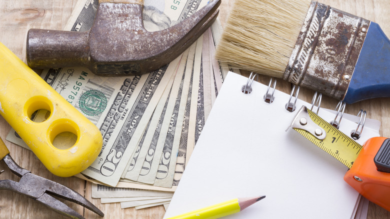 Money and home improvement tools