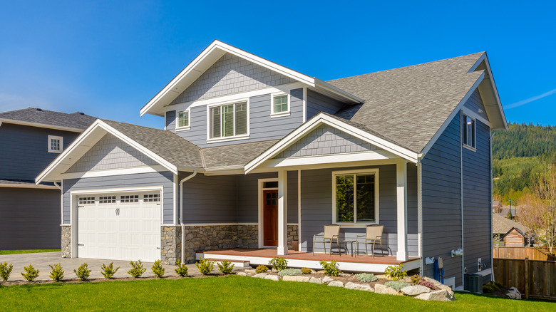 gray suburban house with porch