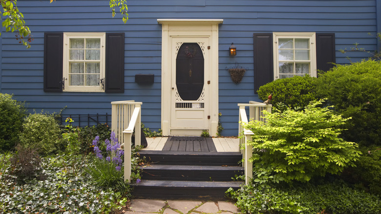 blue house with white door 