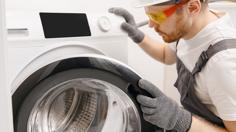 plumber checking washing machine