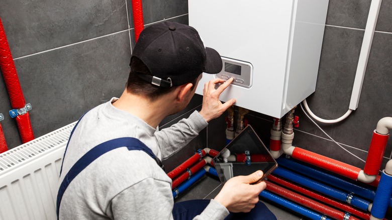 man working on water heater