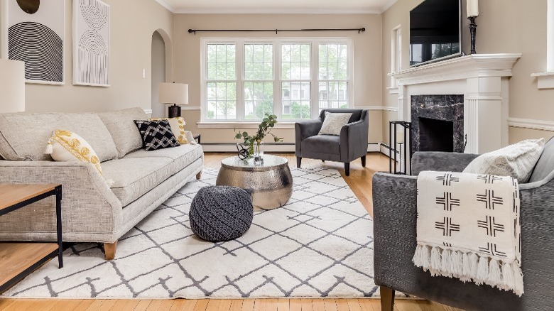 Room with white and gray area rug