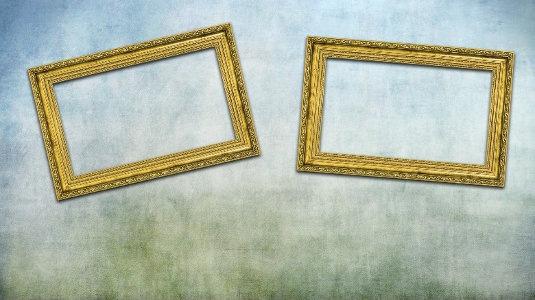 Two crooked gold picture frames