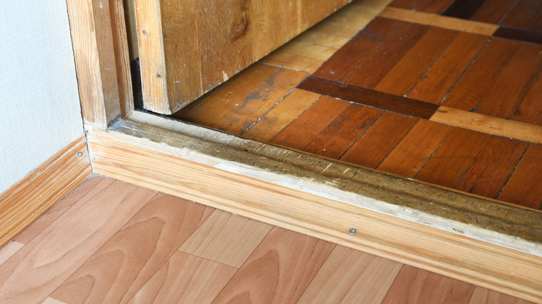 Wood threshold between 2 rooms