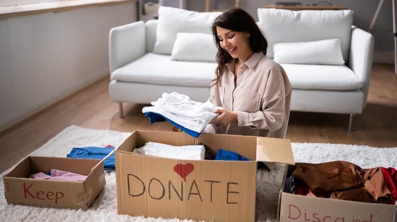 Woman decluttering sorting things out