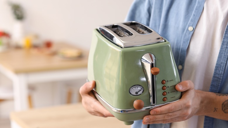 Holding toaster