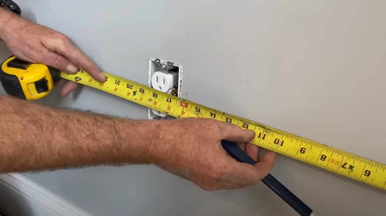 using tape measure near outlet