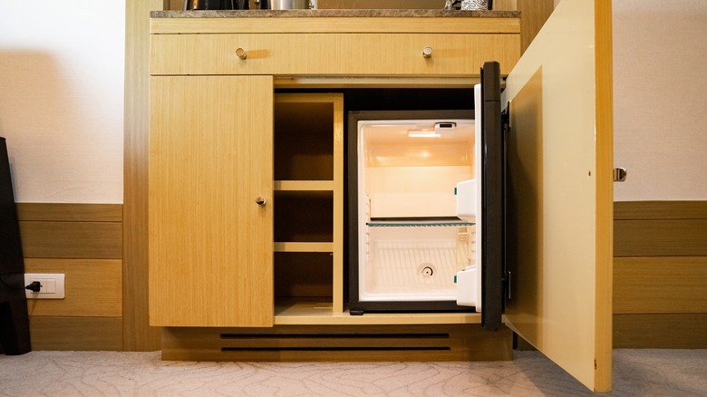 mini-fridge inside a cabinet