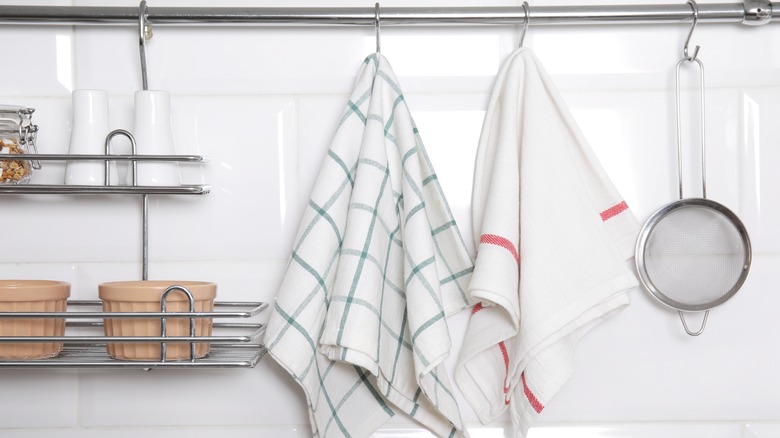 kitchen towels hanging from hooks