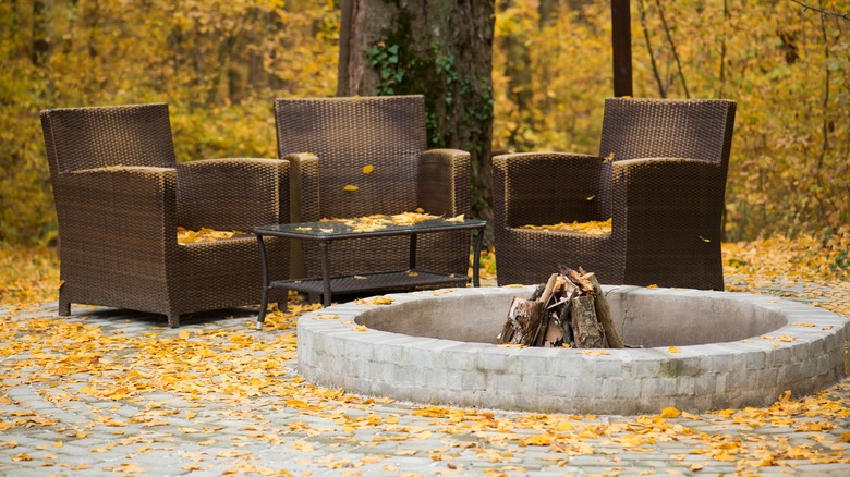 patio furniture covered with leaves