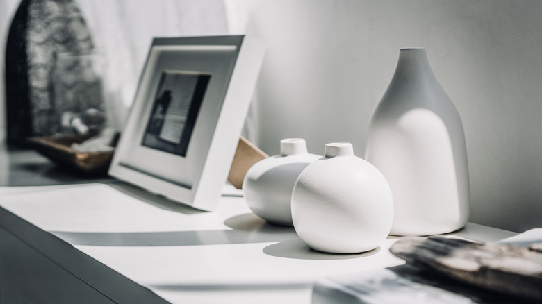 A shelf with personal and decor items.