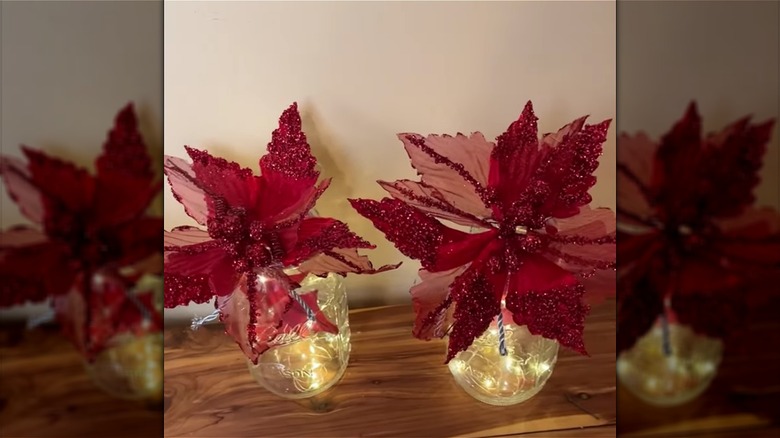 Faux poinsettias in mason jars