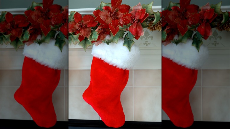 Poinsettias above red stocking