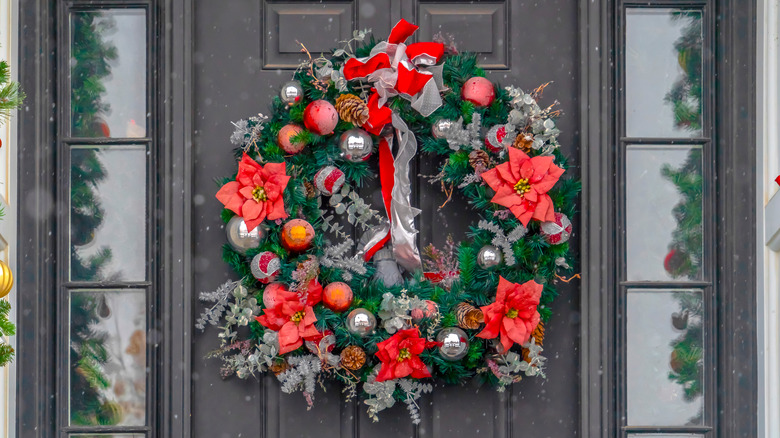 Poinsettia-decorated door wreath