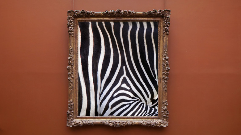 Ornate carved frame with zebra print