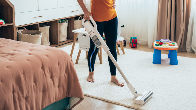 vacuuming bedroom carpet