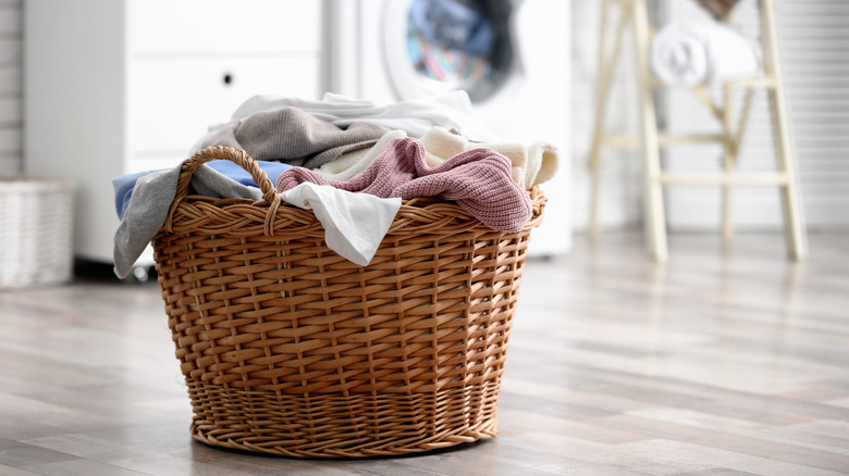 basket of laundry near washer