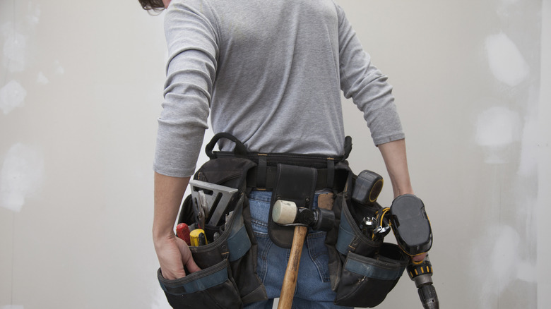 Person wearing a full tool belt