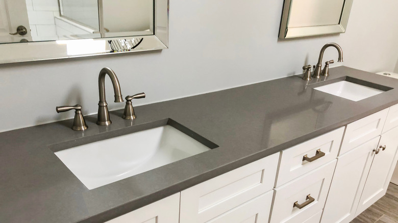 Bathroom sinks with double-handle faucets
