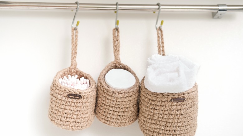 woven bins hung in bathroom