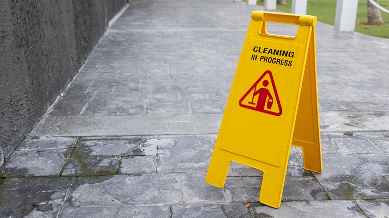 cleaning sign on slate patio