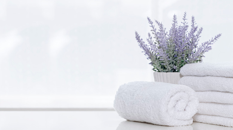 Fluffy towels and lavendar plant