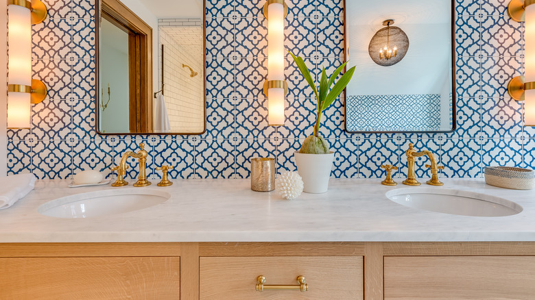 Stone countertop, gold faucet, and cabinet ha