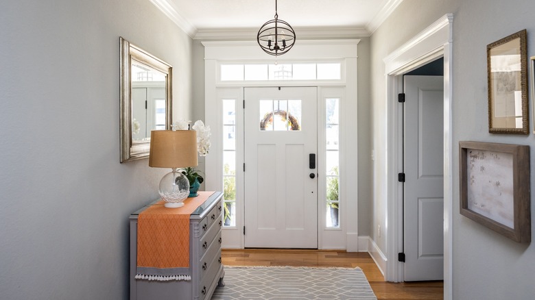 Entryway with mirror, pendant light, console table