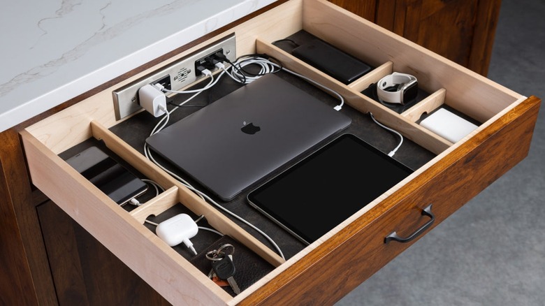 Open kitchen drawer with built-in charging outlets