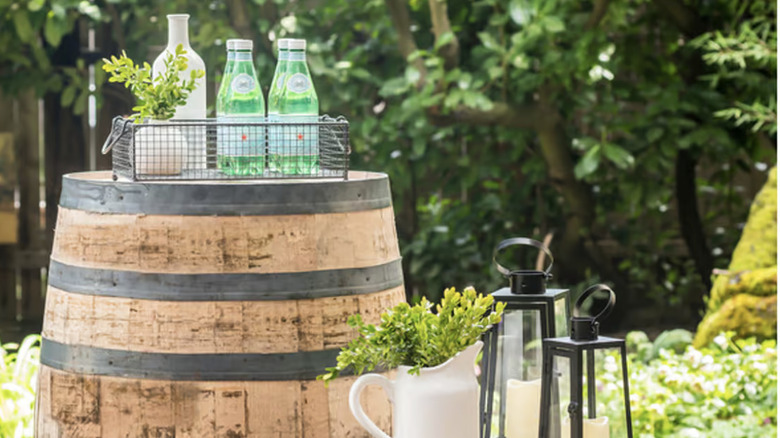 Jack Daniels Whiskey Barrel serving as table outside