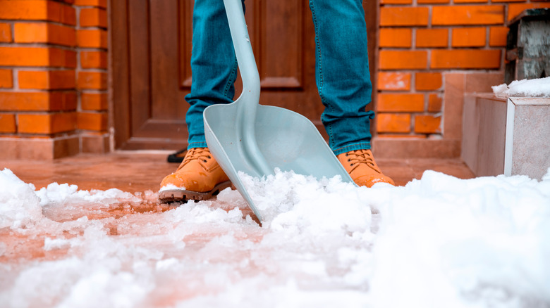 Shoveling snow at door