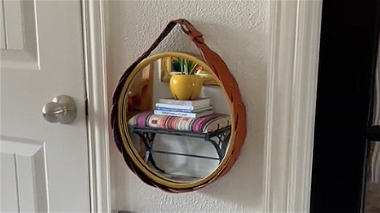 mirror wrapped with belt