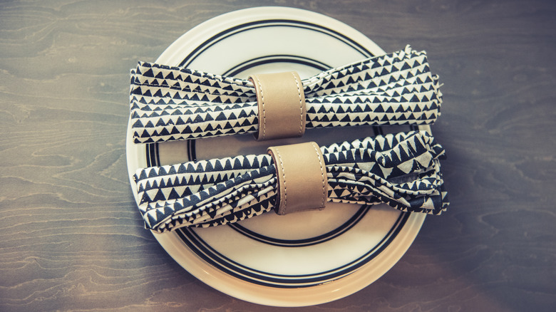 table setting with leather napkin ring