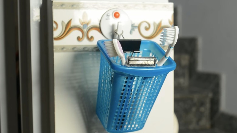 basket attached to wall with binder clip