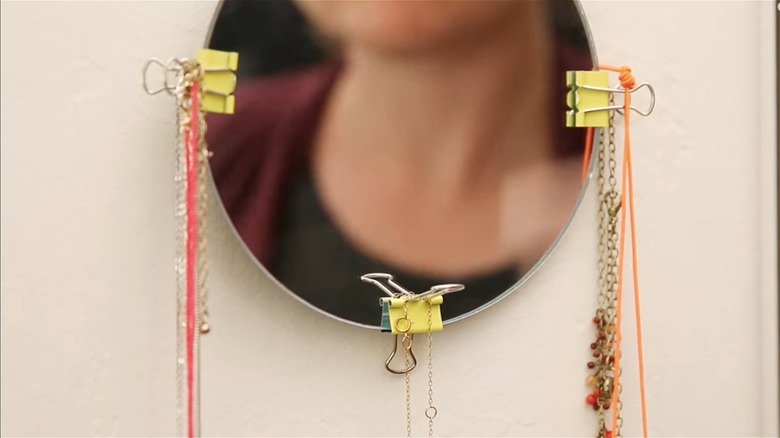 necklaces hanging from binder clips